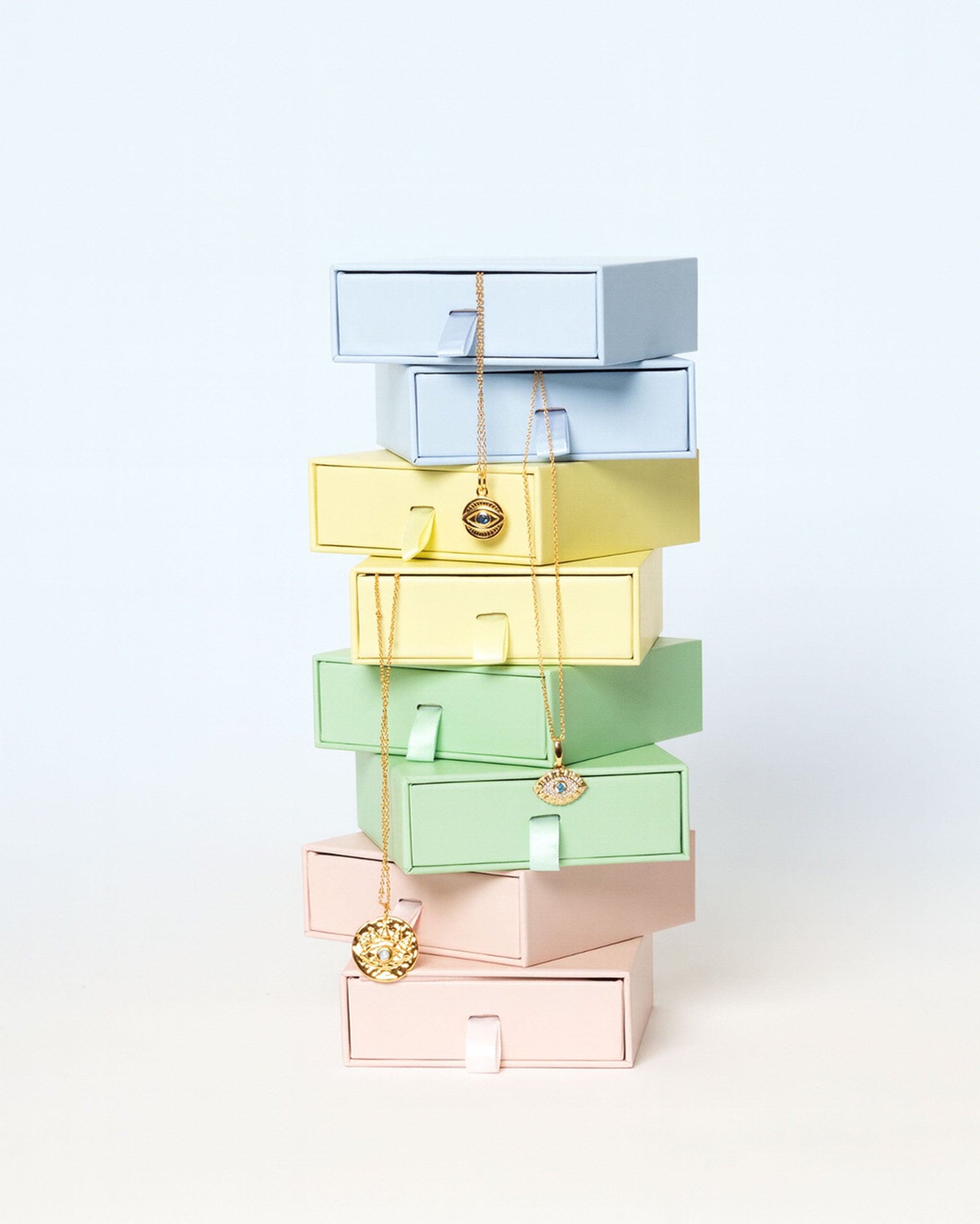 Stack of colourful jewellery gift boxes.