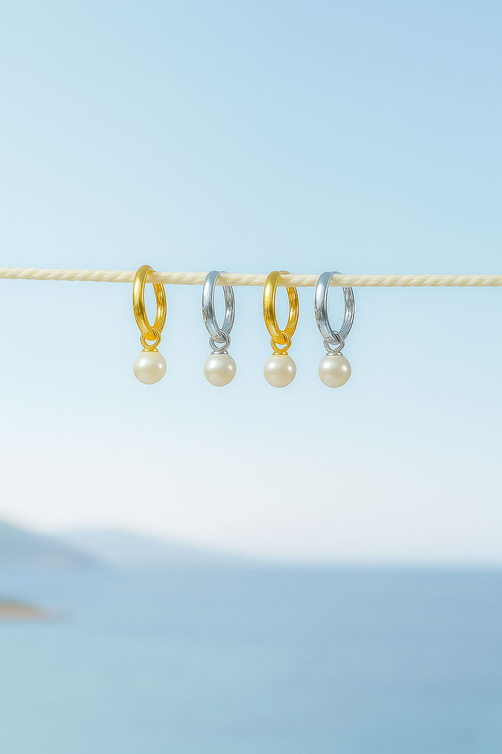 Silver and gold pearl earrings.