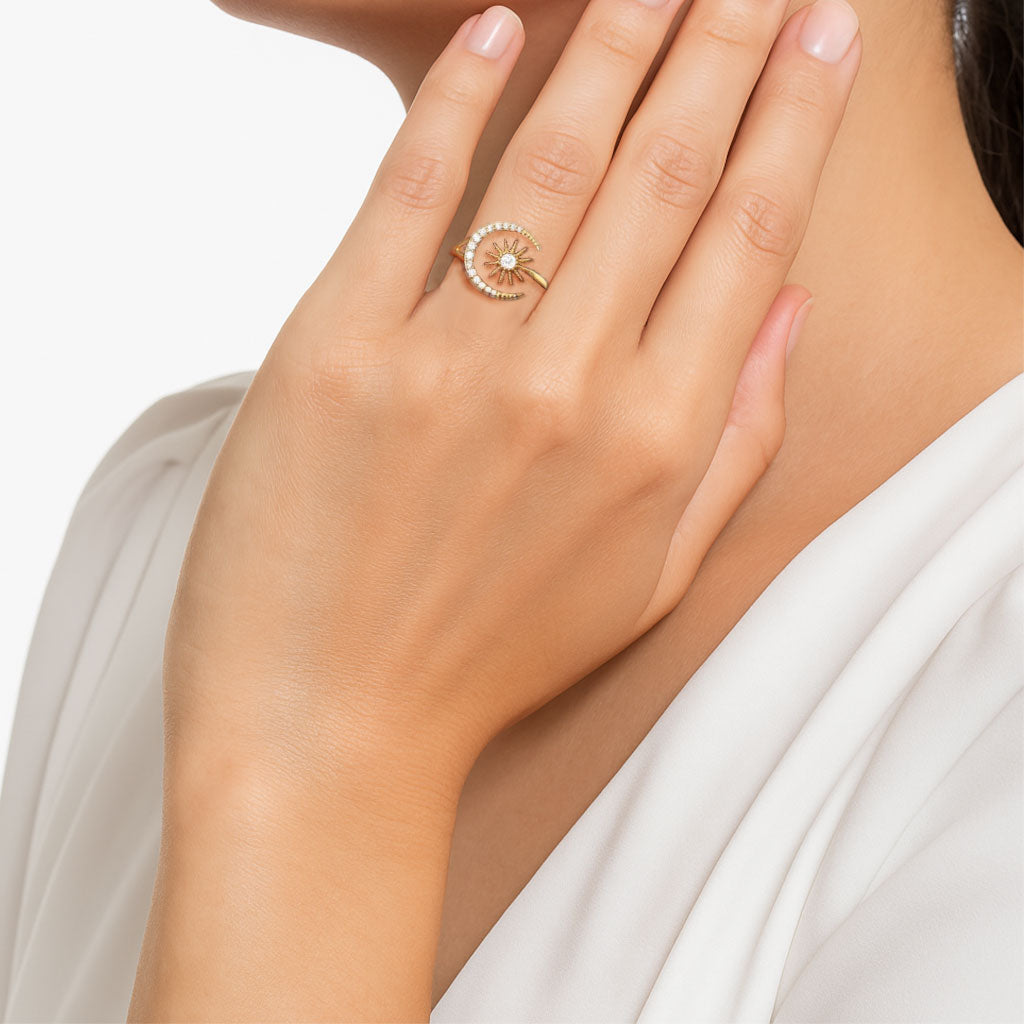 Hand wearing a delicate gold ring.